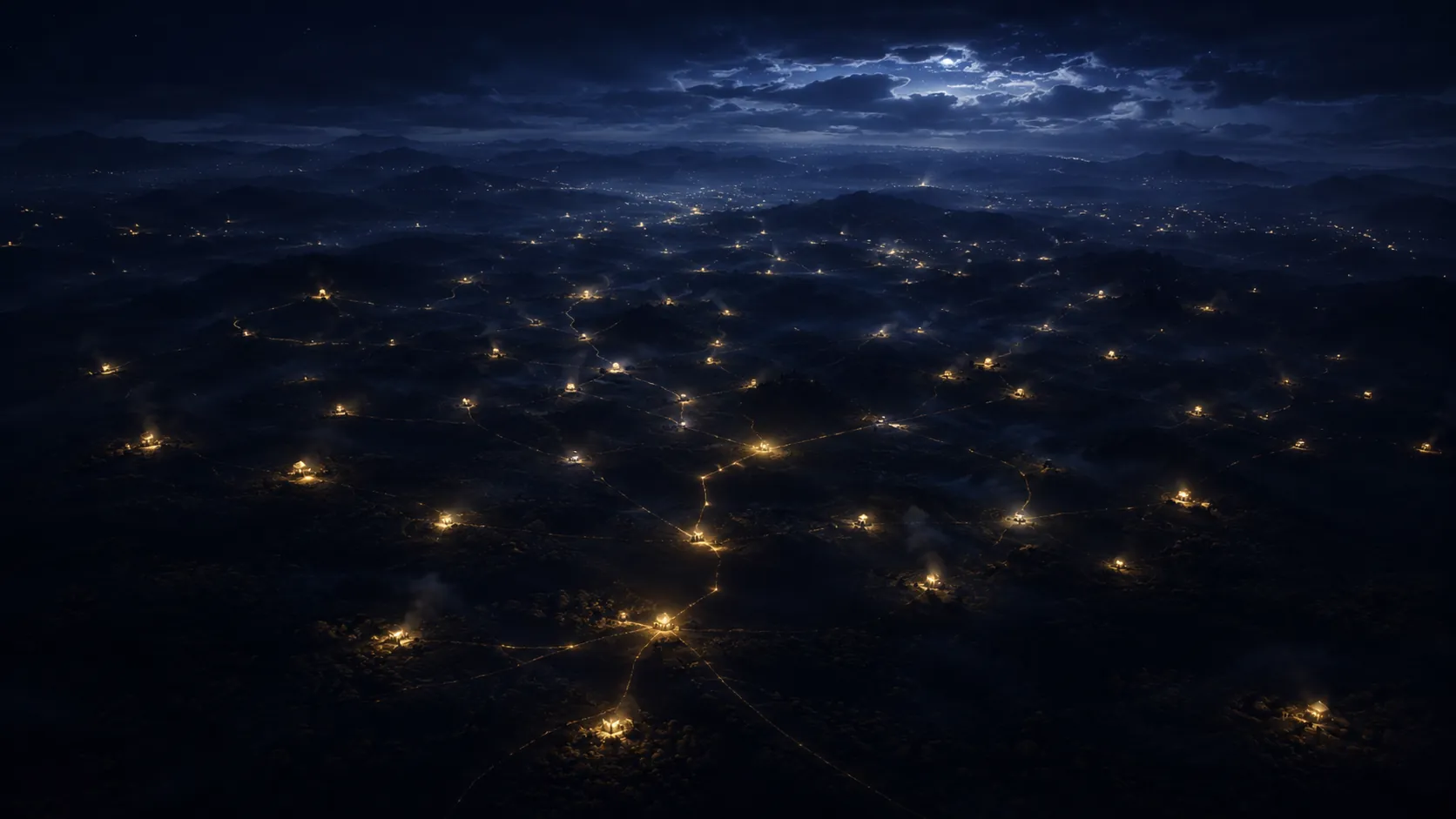 Una constelación de luces doradas dispersas en la tierra, vista desde lo alto en la noche